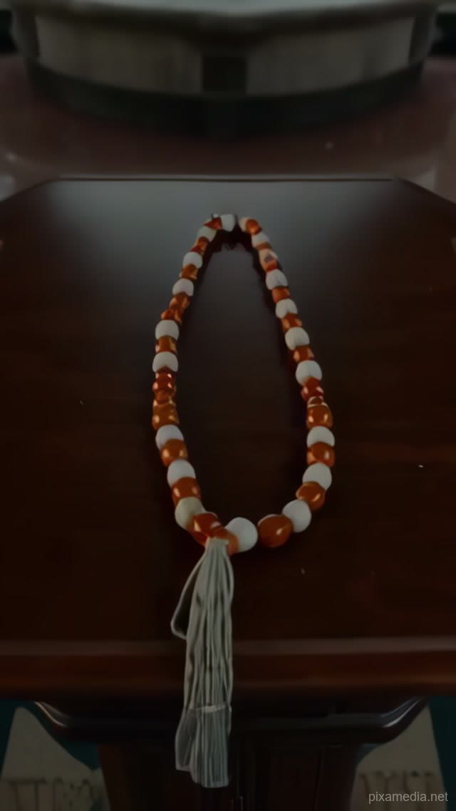 Amber Beads on Walnut Table - Islamic AI stock